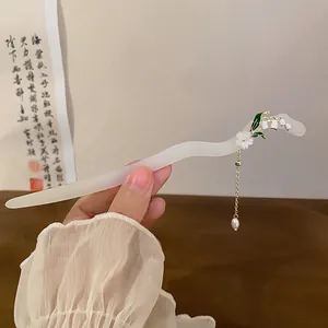 Elegant lily of the valley hairpin with pearl tassel for traditional Chinese Hanfu style.