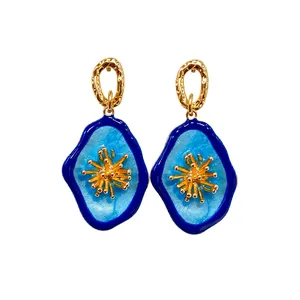 Handcrafted vintage style stud earrings with organic blue enamel and gold floral design