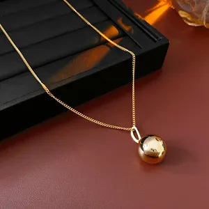 Minimalist gold-plated stainless steel necklace with polished ball pendant