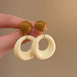 Retro bohemian geometric hoop earrings with brown studs and beige resin pendants