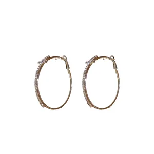 Elegant silver needle gold hoop earrings with sparkling cross-shaped diamond inlay