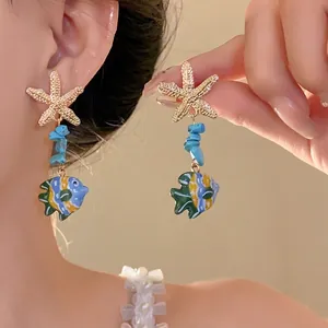 Elegant ocean-inspired starfish and colorful glass fish pendant earrings for beach vacations