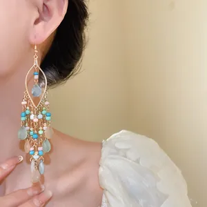 Detailed close-up of Bohemian style beaded chandelier earrings with colorful water drop charms