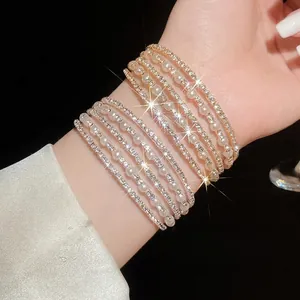 Multi-layer open bracelet with rhinestones and pearls for a luxurious high-end feminine look.
