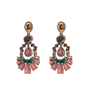 Elegant vintage resin floral drop earrings with pink stones and sparkling rhinestone accents