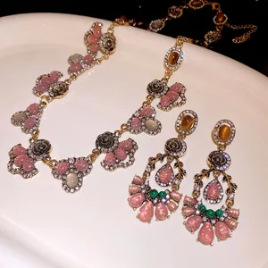 Detailed macro view of vintage resin necklace and earring set with flower patterns