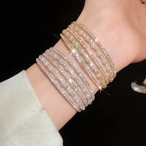 Close-up detail of an elegant multi-layer cuff bracelet with sparkling rhinestones and pearls