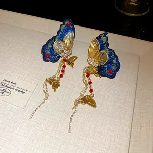 Elegant embroidered butterfly tassel earrings with rhinestones in ethnic style for women.