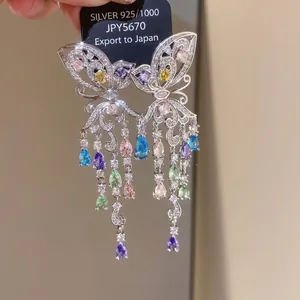 Elegant butterfly dangling earrings with colorful zircon crystals and long tassels.