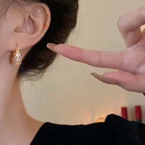 Elegant gold-plated geometric hoop earrings with sparkling pavé cubic zircon stones