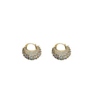 Elegant gold-plated hoop earrings pavé-set with sparkling cubic zirconia crystals.
