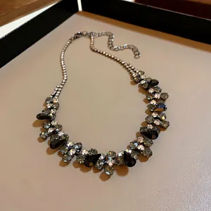 Detailed macro view of black teardrop crystal clusters on an elegant necklace design