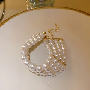 Elegant French style multi-strand white pearl bracelet with gold adjustable chain