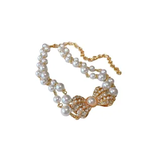 Elegante collana di perle a doppio strato con fiocco di strass, stile vintage francese.