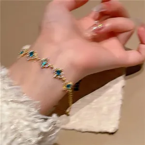 Close-up detail of a stylish zircon rhombus flower link bracelet worn on a wrist