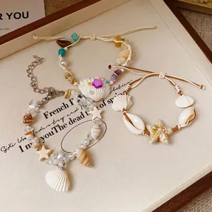 Bohemian beach-themed shell and starfish beaded bracelets with pearls and natural stones