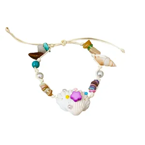 Bohemian handmade natural stone and seashell beaded bracelet with purple star and pearl accents