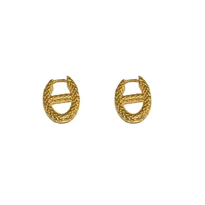 Elegant vintage textured gold metal hoop earrings in unique 'H' shape design for women