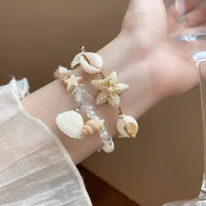 Bohemian beach vacation bracelet set featuring shells, starfish charms and pearls