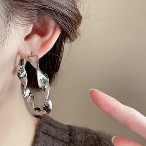 Large twisted spiral hoop earrings in polished silver finish for stylish women's jewelry