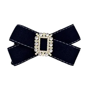 Elegant black fabric bow hair clip with a sparkling rhinestone buckle for women