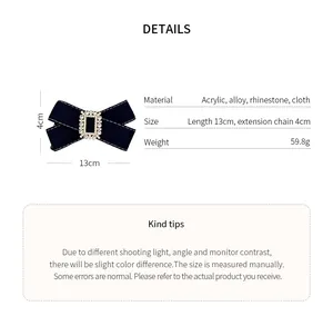 Detailed view of elegant black fabric bow hair clip with luxury rhinestone buckle and sizes