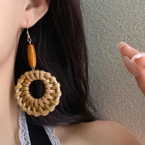Bohemian ethnic rattan woven circular earrings with wooden beads, vintage vacation style