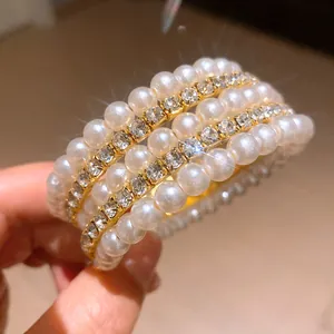Detail of multi-layer bracelet with pearls and rhinestones in vintage French style