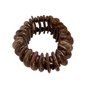 Bohemian ethnic style dark brown wood bead bracelet featuring natural coconut shell discs