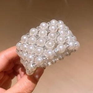 Close-up of multi-layer pearl bracelet with sparkling rhinestone accents for a luxury look