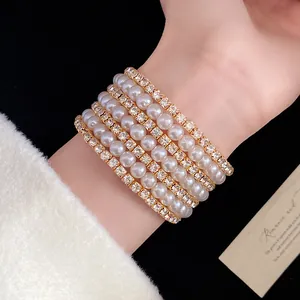Detail view of a multi-layer pearl and rhinestone vintage French style bracelet