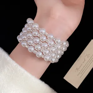 Macro view showing detail of multi-layer pearl bracelet with sparkling rhinestone spacers