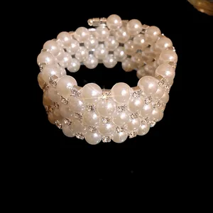 Close-up of a elegant multi-layer faux pearl bracelet with sparkling rhinestone spacers