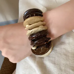 Close-up of Bohemian style multi-layer wooden bead bracelet with natural textures