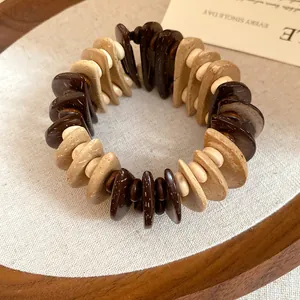 Macro view of a handcrafted bohemian wooden bead bracelet with mixed earthy brown tones
