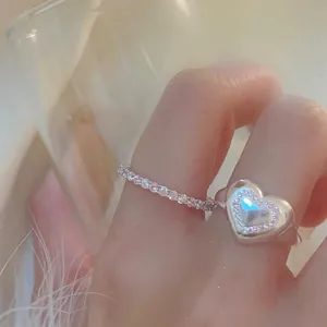 Detailed view of elegant silver-tone heart-shaped zircon open ring for women on finger