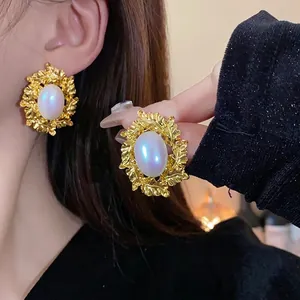 Vintage oval pearl leaf statement earrings with gold-plated ornate design for women