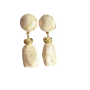 Elegant Korean style marbled resin drop earrings with gold twisted metal accents.