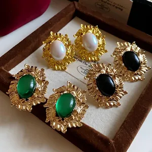 Vintage Baroque gold leaf stud earrings with oval emerald pearl stones
