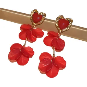 Elegant red heart petal tassel earrings with gold-toned finish and silver needles