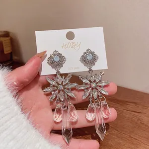 Exquisite silver floral earrings with faceted dangling crystal drops for elegant women