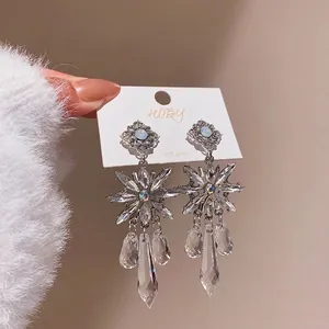 Elegant silver needle crystal snowflake drop earrings with sparkling rhinestone details