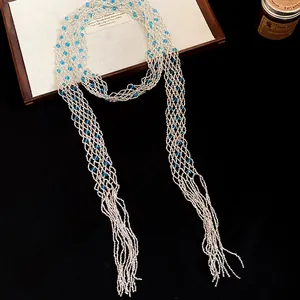 Exaggerated vintage glass beaded hollow long necklace with blue accents and tassel details