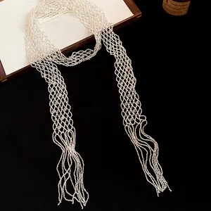 Detailed view of a retro hollow beaded long necklace with elegant fringe tassels