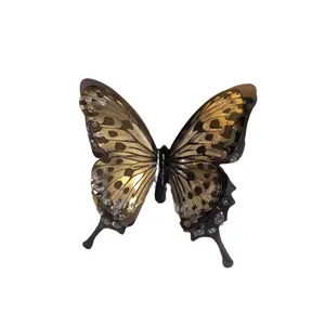 Elegant golden butterfly open ring with sparkling rhinestone accents on white background