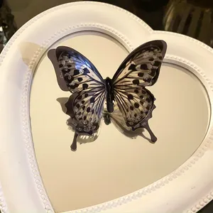 Detailed macro shot of ethereal butterfly open ring featuring sparkling gradient wing details