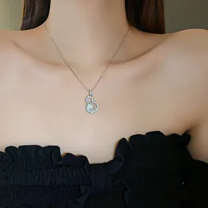 Elegant gourd-shaped necklace with shimmering zircons and a central white pearl detail