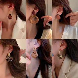 Collection of elegant brown Maillard style resin and fabric earrings for autumn winter