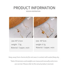 Detail of retro resin pendant necklaces in heart and oval shapes with copper chain.