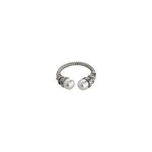Elegant silver twisted cable open ring featuring two white pearls and zircon accents